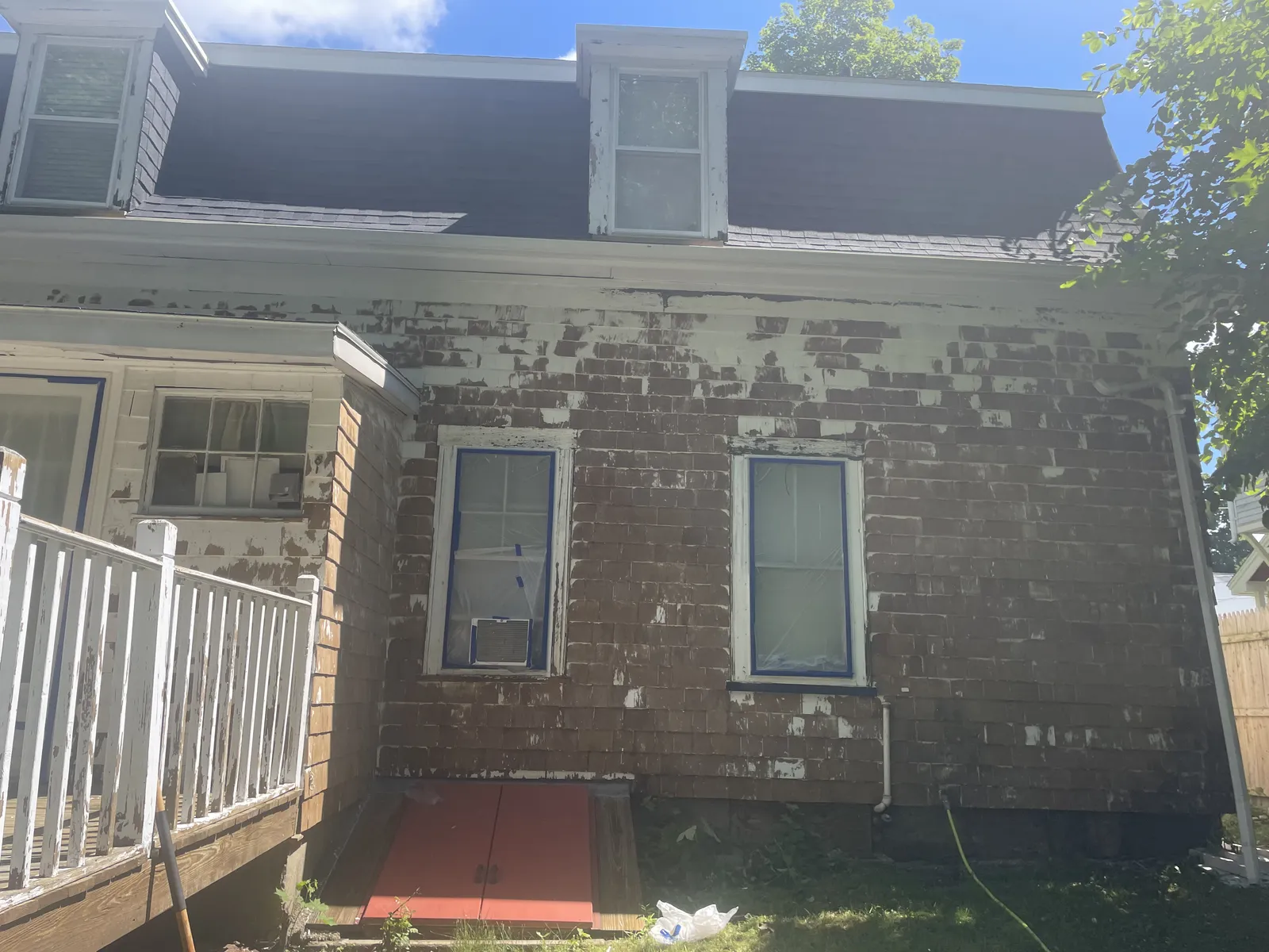 Home exterior before and after – before